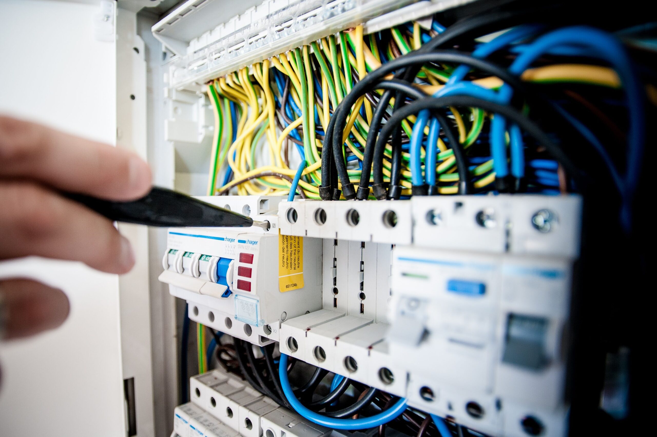 electrician checking fusebox in harlow